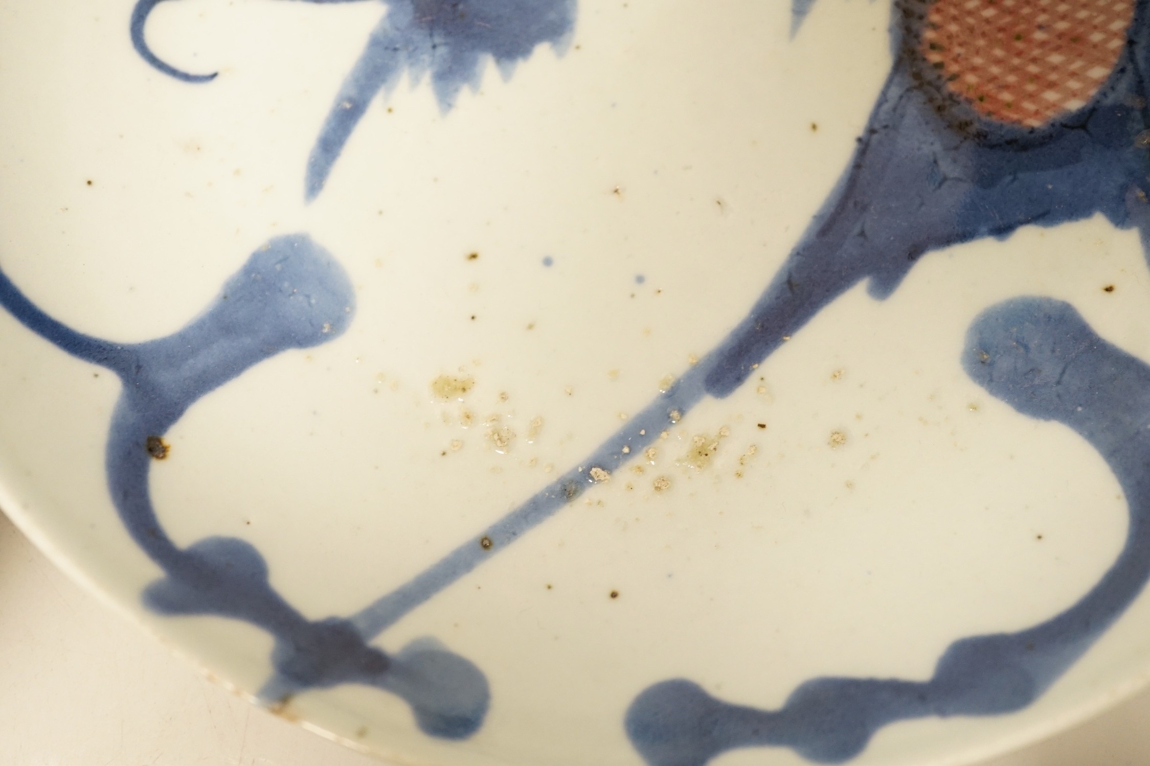 Two 19th century Chinese blue and white dishes and two 18th century tea bowls, largest 23cm diameter